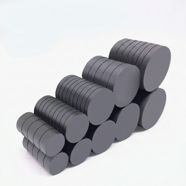 Graduated ferrite disc magnets arranged in pyramid stack for multi-size procurement review.